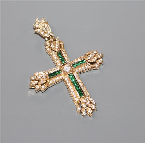 A modern yellow metal and two colour gem set cross pendant,